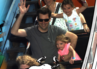 Travis Simpson with his wife and kids on roller coaster
