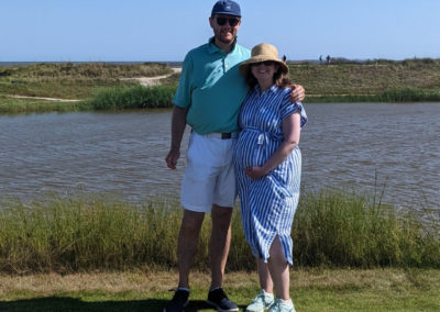 CLarissa Brown Hoffman and her husband posed together on a golf course.