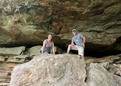 Kendra Stribling and her husband smile while on a hike.