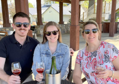 Kendra Stribling and her two adult children enjoy a glass of wine