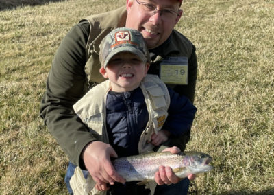 Matthew Hale and his young son pose with a fish they caught.