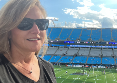 Jennifer Lehman wearing a Panthers T-shirt in the Panther's Football Stadium