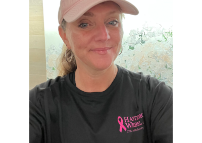 Jennifer Lehman wearing her Black and Pink HW Women's 4 miler running shirt